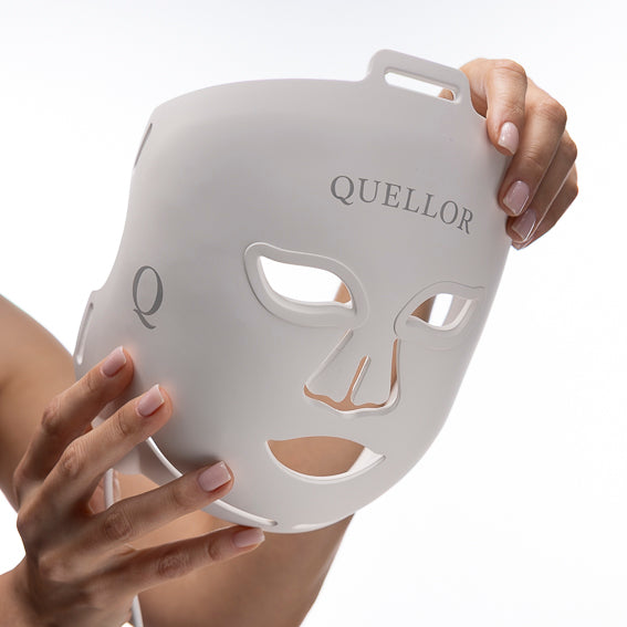 Elena holding the Quellor LED mask, highlighting its flexible design and precision construction