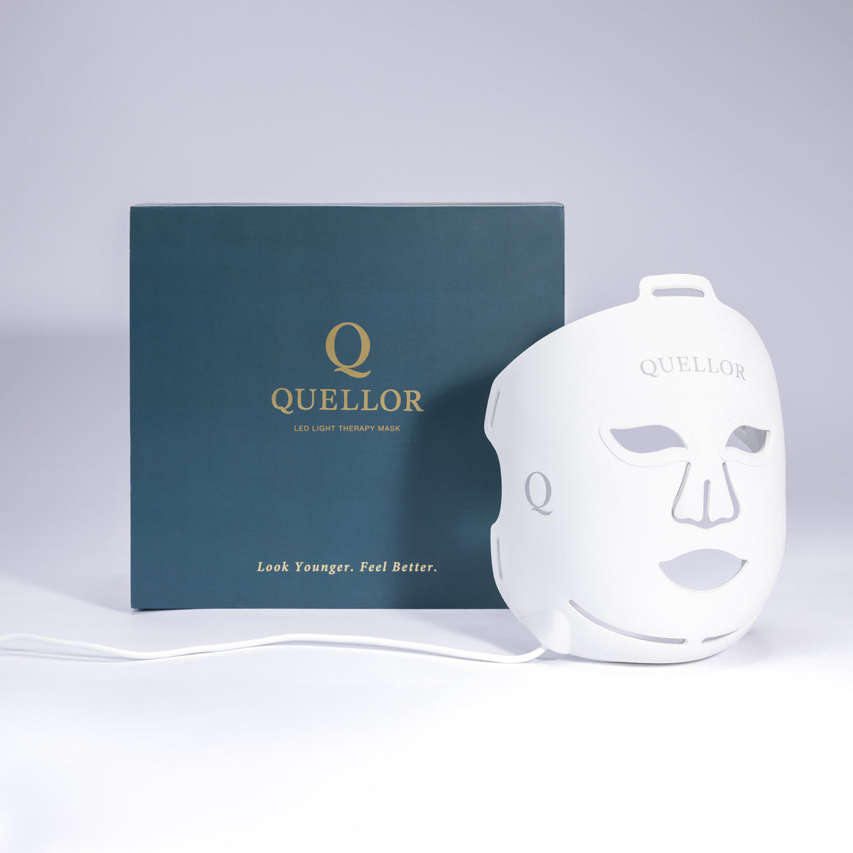 Quellor LED light therapy mask displayed beside its teal presentation box